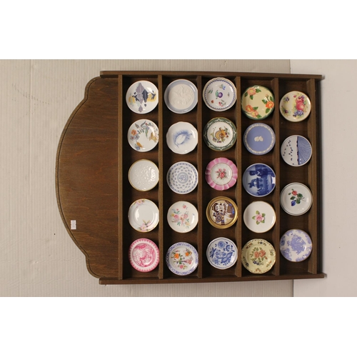 519 - A Set of 24 Miniature Plates on a Wooden Stand to include makers such as Franciscan, Wedgwood, Okura... 