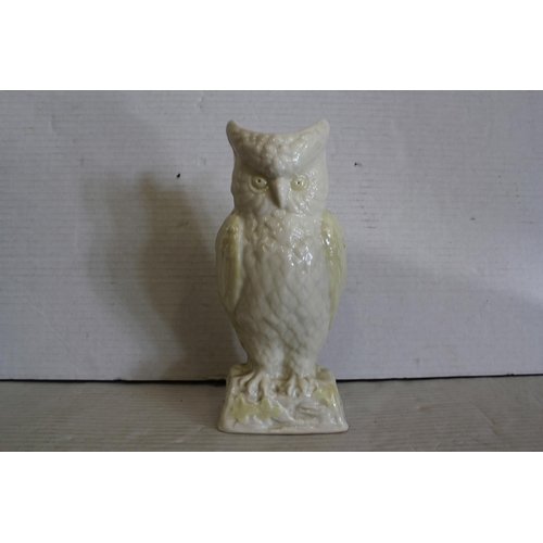 548 - A Belleek Owl Flower study with a yellow buff glaze, No: 0857 Entrelac.