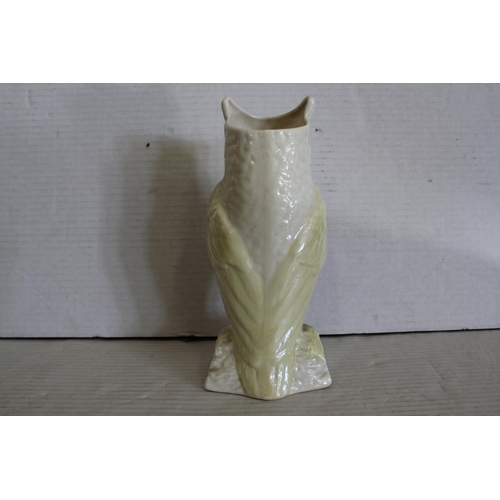 548 - A Belleek Owl Flower study with a yellow buff glaze, No: 0857 Entrelac.