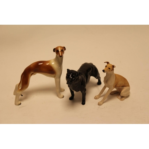 554 - A Royal Doulton Black Glazed Study of a Staffordshire Dog along with two others.