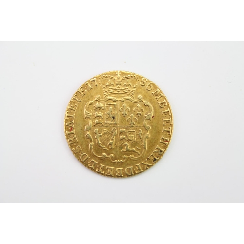 270 - A 1786 George III Gold Guinea, Reverse Crowned Shield of Arms. Weighing: 8.3 grams.