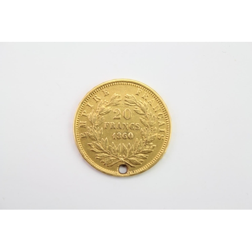 275 - An 1860 Gold 20 French Francs Napoleon III with drilled hole. Weighing: 6.3 grams.