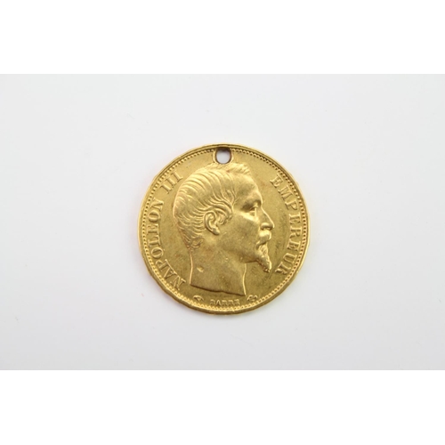 275 - An 1860 Gold 20 French Francs Napoleon III with drilled hole. Weighing: 6.3 grams.