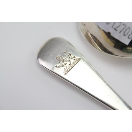 32 - A Pair of Silver Old English Rat Tail sauce ladles by George Adams, London E, with family crest.