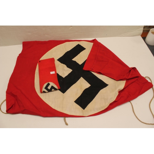 304 - A Nazi Design Flag in Red, White & Black along with a matching Armband. 137cm x 72cm Flag.