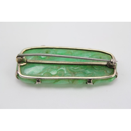 150 - A Green Jade mounted Brooch.