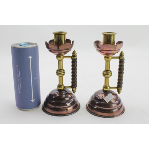 604 - A Pair of Brass & Copper Christopher Dresser inspired Candlesticks by Benham & Froud.