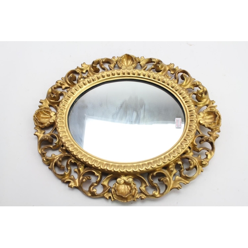 432 - A Late 18th Century design gilded and carved wall mirror. Measuring - 40cm x 34cm.