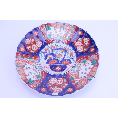 233 - A Large Japanese Imari decorated Wall Plate with scenes of birds in flight, lanterns & Vase of flowe... 