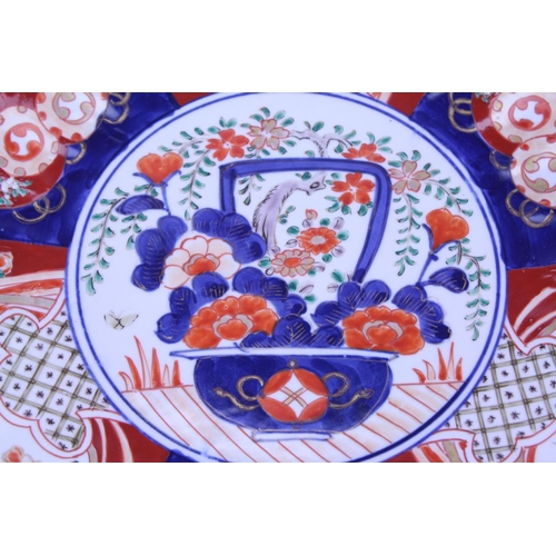 233 - A Large Japanese Imari decorated Wall Plate with scenes of birds in flight, lanterns & Vase of flowe... 