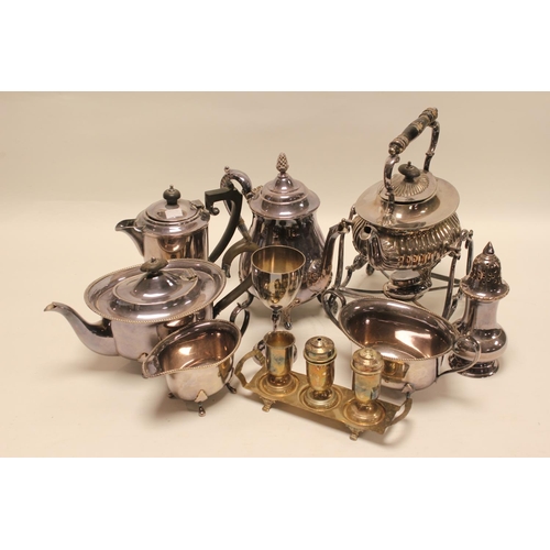 66 - A Silver Plated Teflon Stand, Silver Plated Tea Pot, Sugar Castor, Cruet Set, etc.