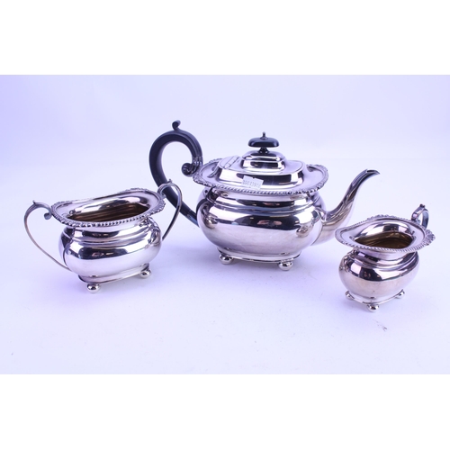 78 - A Three Piece Georgian Design Silver Plated Tea Set with gadroon decoration.