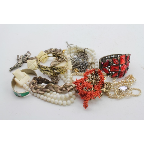 93 - A Natural Coral Necklace, a Star Brooch, African Bone Jewellery along with other costume jewellery.