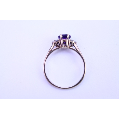 144 - A Ladies 9ct Gold Ring set with an amethyst. Size: n. Weighing: 1.7 grams.