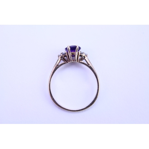 144 - A Ladies 9ct Gold Ring set with an amethyst. Size: n. Weighing: 1.7 grams.