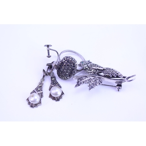 148 - A Silver Set & Marcasite Brooch, a Similar Dress Ring and two long drop Earrings.