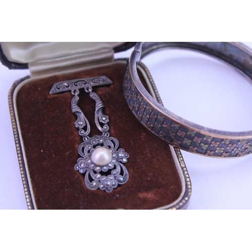 149 - A Victorian Silver Bangle along with a (935) marked Hanging Brooch in an Original Box.