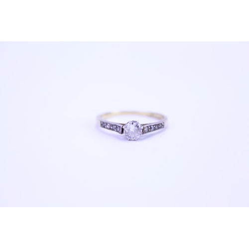 158 - An 18ct Gold & Platinum mounted Single Stone Diamond Ring with Chip Shoulders. Size: k. Weighing: 1.... 