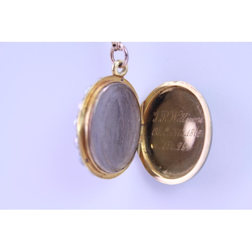 90 - A Victorian Mourning Locket with seeded pearl edge, Cross Set diamonds, Onyx Back on a 9ct Gold Chai... 