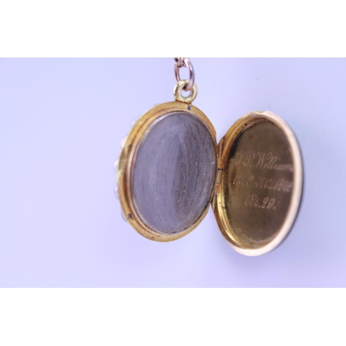 90 - A Victorian Mourning Locket with seeded pearl edge, Cross Set diamonds, Onyx Back on a 9ct Gold Chai... 