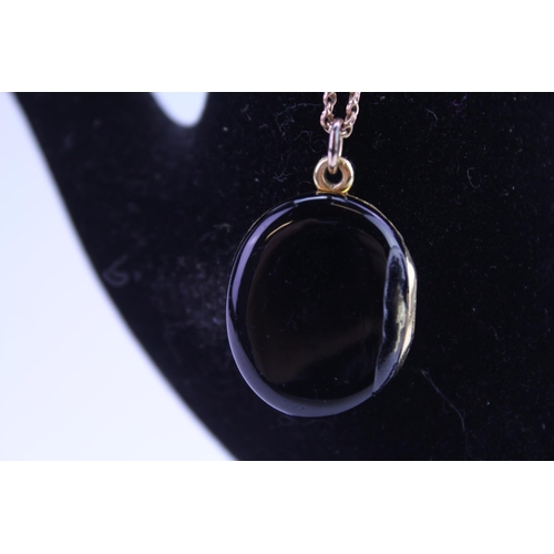 90 - A Victorian Mourning Locket with seeded pearl edge, Cross Set diamonds, Onyx Back on a 9ct Gold Chai... 