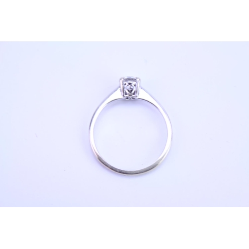 92 - A Ladies 18ct White Gold Dress Ring mounted with a Single Diamond in Original Box. Size: L.