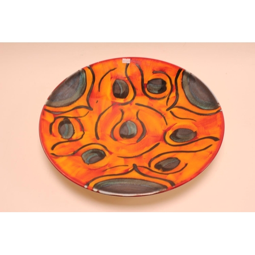 877 - A Large Poole Pottery Decorative Plate in Orange & Green. Measuring: 41.5cms across.