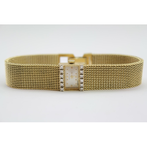 208 - A ladies Hamilton wrist watch, mounted with 12 diamonds, and a 14K Gold Milanese strap. Total Weight... 