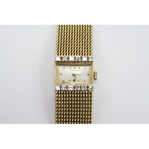 208 - A ladies Hamilton wrist watch, mounted with 12 diamonds, and a 14K Gold Milanese strap. Total Weight... 