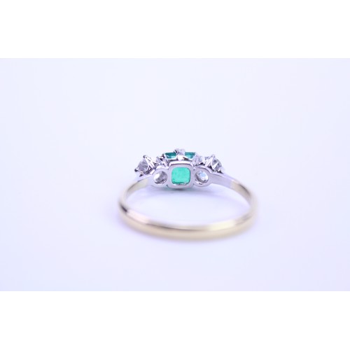 142 - An 18ct Gold Emerald & Diamond Dress Ring. Size: q. Weighing: 3.6 grams.