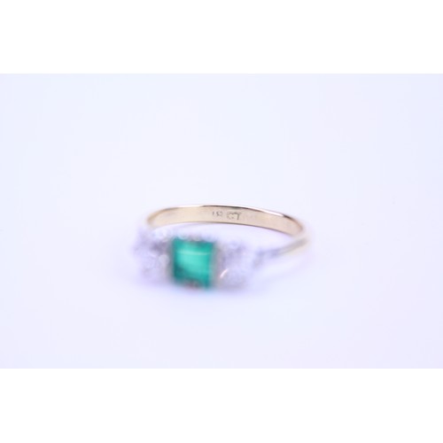 142 - An 18ct Gold Emerald & Diamond Dress Ring. Size: q. Weighing: 3.6 grams.