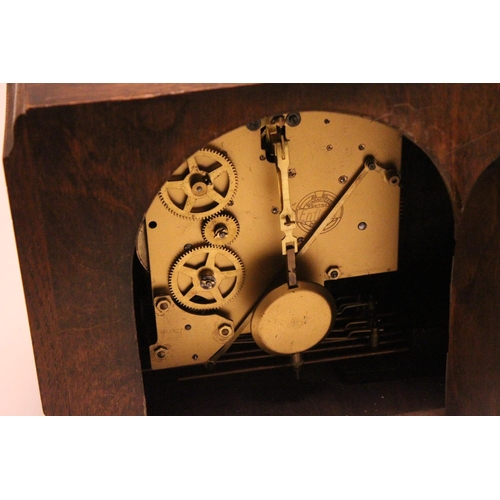 217 - Art Deco square oak cased clock, with white painted chapter ring, chrome door, and 3 key holes.