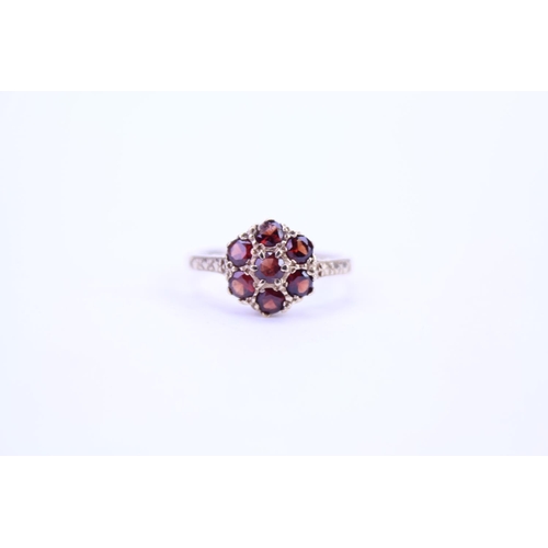 90 - A Ladies 9ct Gold Garnet Cluster Ring with Cut Shoulders. Weighing: 2.1 grams. Size: M.