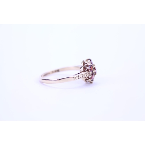 90 - A Ladies 9ct Gold Garnet Cluster Ring with Cut Shoulders. Weighing: 2.1 grams. Size: M.