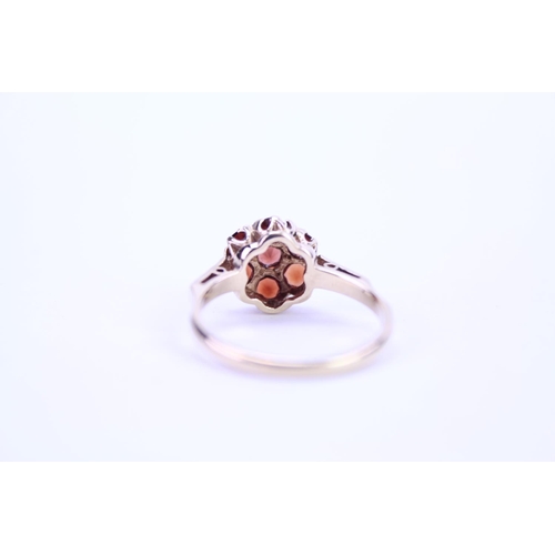 90 - A Ladies 9ct Gold Garnet Cluster Ring with Cut Shoulders. Weighing: 2.1 grams. Size: M.