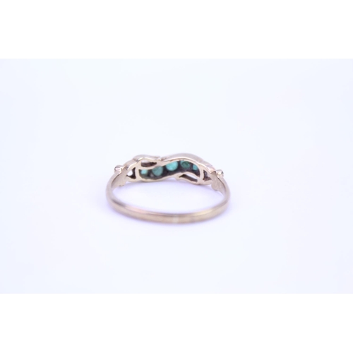 101 - A ladies 9ct Gold dress ring mounted with 5 emeralds. Size approx N.