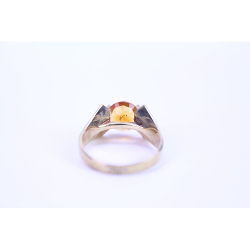 102 - A ladies 1970's 9ct Gold dress ring mounted with a stone. Size approx L.