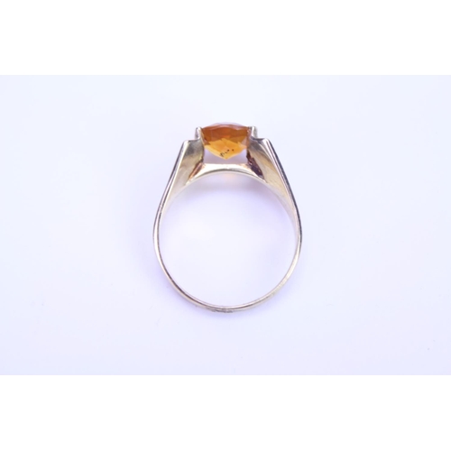 102 - A ladies 1970's 9ct Gold dress ring mounted with a stone. Size approx L.