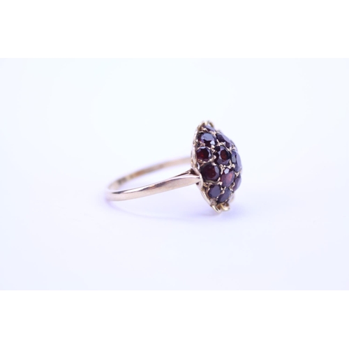 105 - A 9ct Gold dress ring mounted with garnets. Size approx Q.