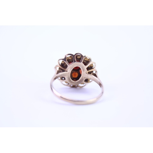 105 - A 9ct Gold dress ring mounted with garnets. Size approx Q.