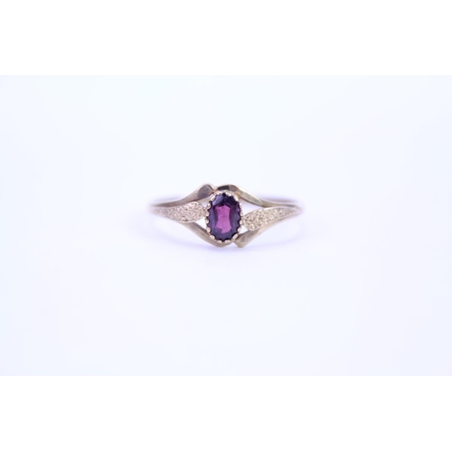 107 - A ladies 9ct Gold garnet set dress ring. Size approx T.