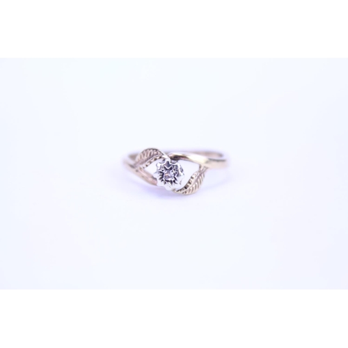 108 - A ladies 9ct Gold dress ring set with a small Diamond. Size approx M.