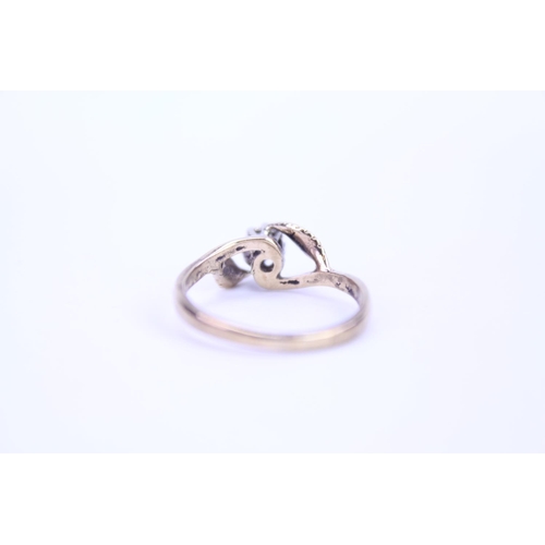 108 - A ladies 9ct Gold dress ring set with a small Diamond. Size approx M.