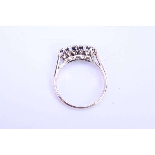 115 - A ladies 9ct Gold dress ring set with illusion set diamonds. Size approx M.