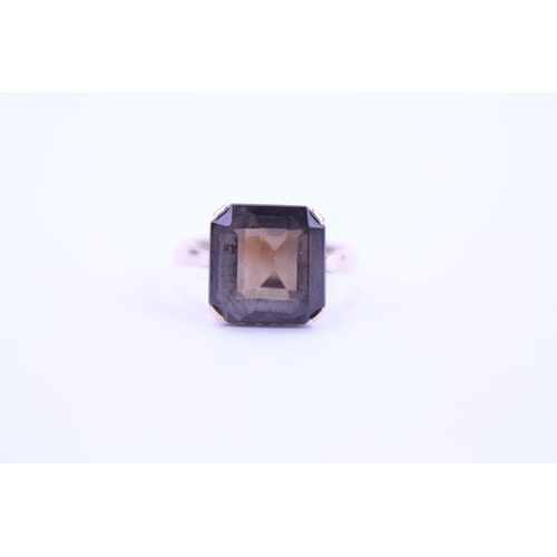 118 - A 14k Gold dress ring set with a continental Smokey quartz. Size approx Q.