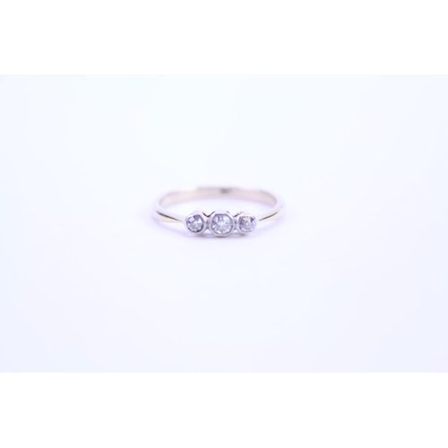 124 - A ladies 18ct Gold dress ring set with diamonds. Size approx M.