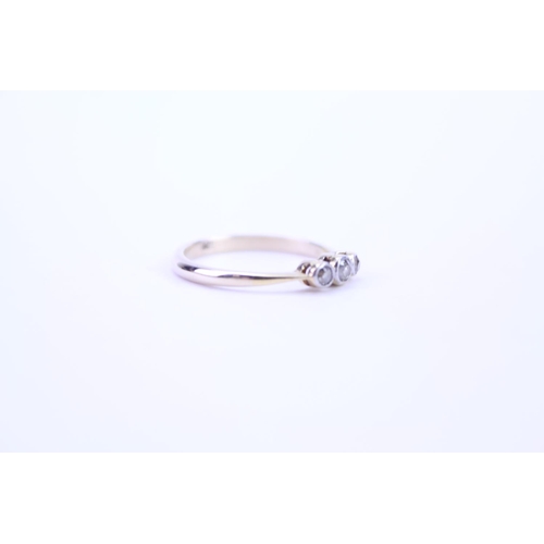 124 - A ladies 18ct Gold dress ring set with diamonds. Size approx M.