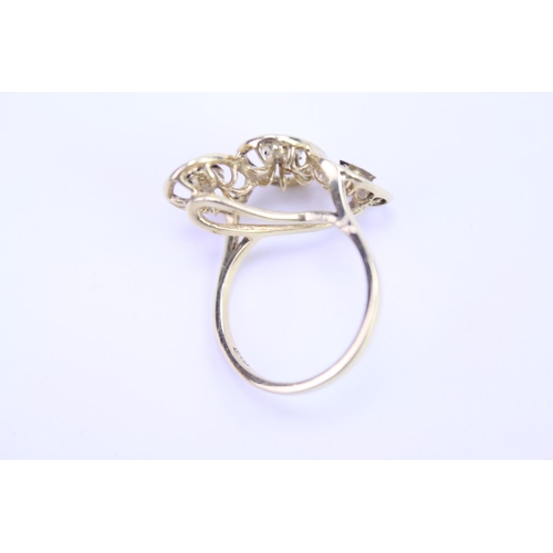 127 - An 18ct yellow Gold dress ring in oval section, highlighted with white gold. Size approx M.