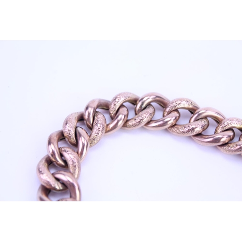 95 - A Victorian 9ct Gold marked and engraved curb bracelet. Weight approx 25 grams.