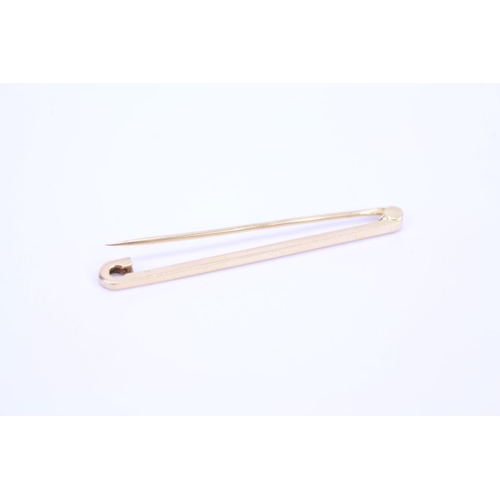 98 - An 18ct Gold tie pin. Weighing: approx 3.5 grams.